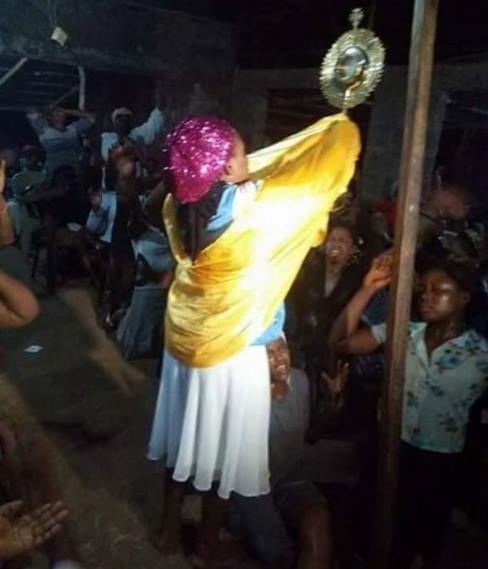 Outrage on social media as Female evangelist lifts the Catholic Monstrance holding the Blessed Sacrament (Photos)