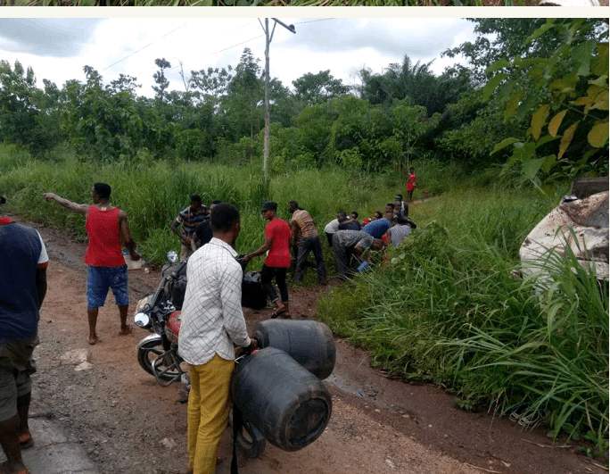 Fuel Tanker Crashes In Cross River State And Residents Rush With Gallons To Scoop Fuel...
