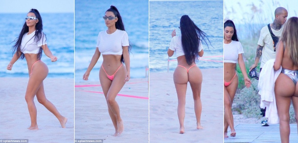 Kim Kardashian flaunts her figure in eye-popping bikini bottoms and a see-through crop top