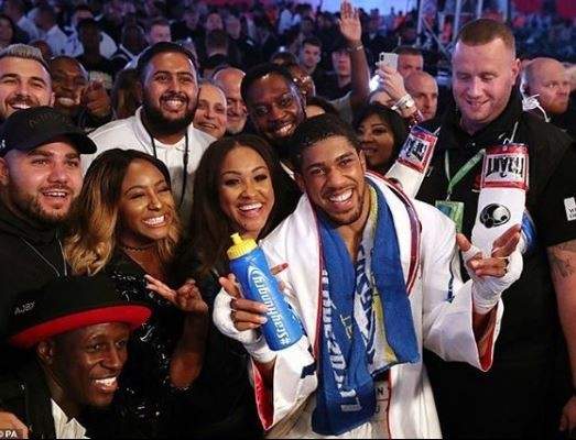 DJ Cuppy pictured with Anthony Joshua after his victory in London