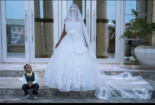 Little Boy who Photobombed Wedding Photoshoot Lands Mega Modelling Deal with Olajumoke. (See photos)