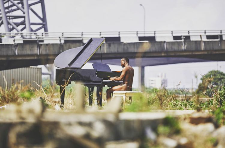 Singer Brymo Shares A Picture Of Himself Playing The Piano Naked, Nigerians React