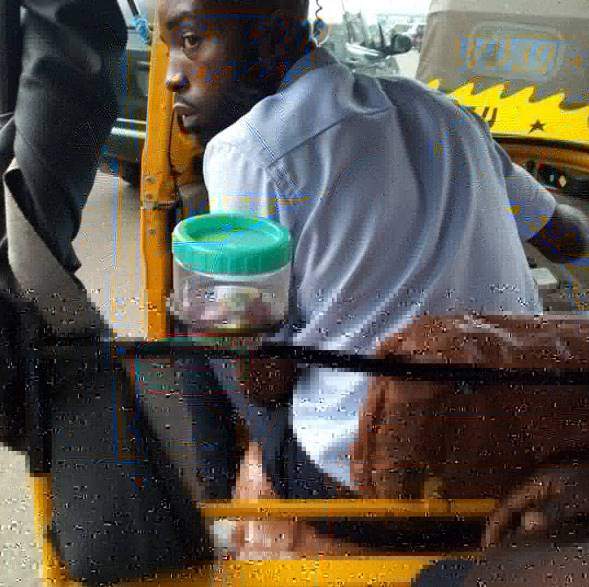 'Corporate keke driver' who has sweets and his business card in his tricycle for passengers goes viral (photos)