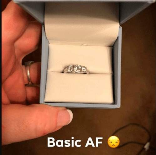 Internet blows up as woman finds diamond engagement ring before boyfriend proposes; says the ring is 'basic AF'