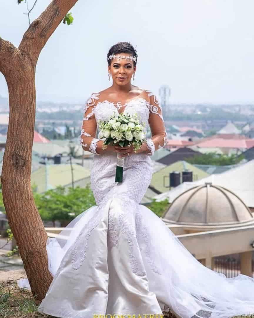 TBoss fuels pregnancy rumors after releasing wedding-themed photos