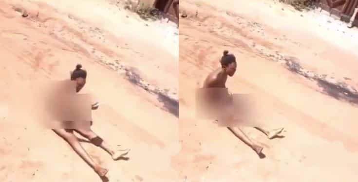 Lady strips naked to curse her boyfriend who dumped her (video)