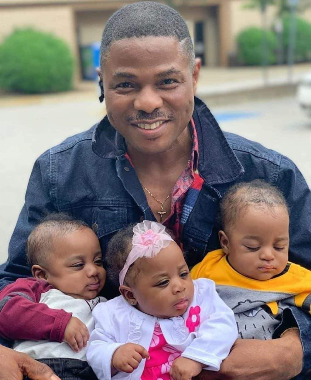 Adorable photo of Yinka Ayafele and his triplets