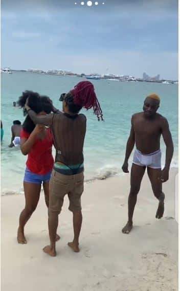 BBNaija's Esther engaging In 'Rough Play' with guys at Dubai beach (Photos)