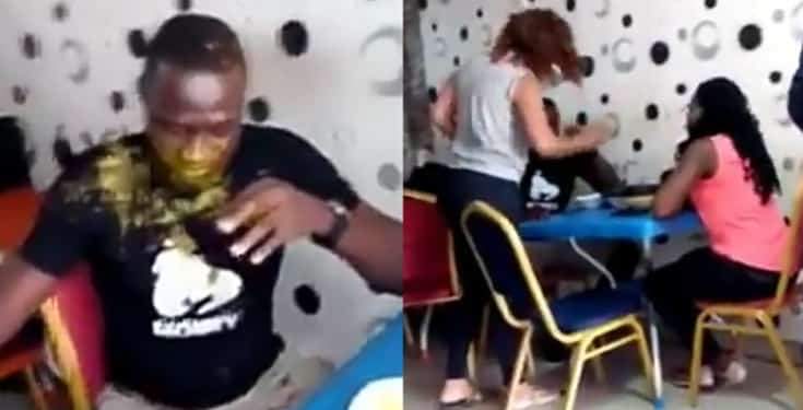 Lady slaps husband multiple times, pours soup on him for going out with side chick (Video)