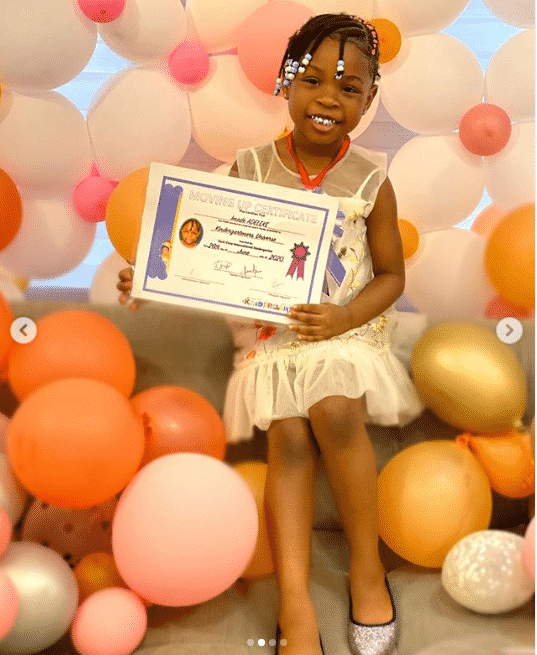 Davido buys his daughter Imade a bicycle as she graduates from kindergarten (Photos)