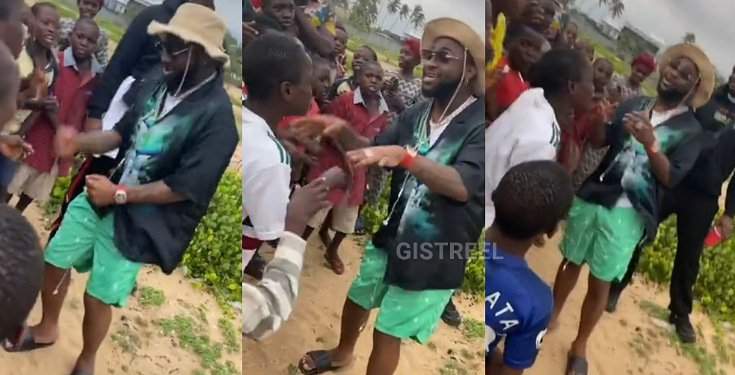 Davido captured singing and dancing with kids on the street (Video)