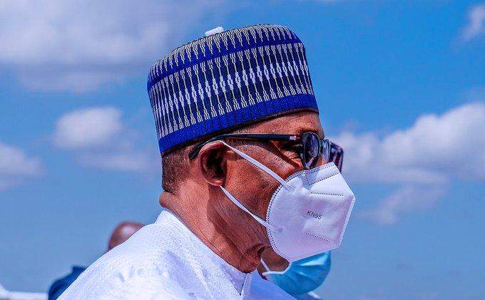 President Buhari finally wears a face mask for the first time (Photos)