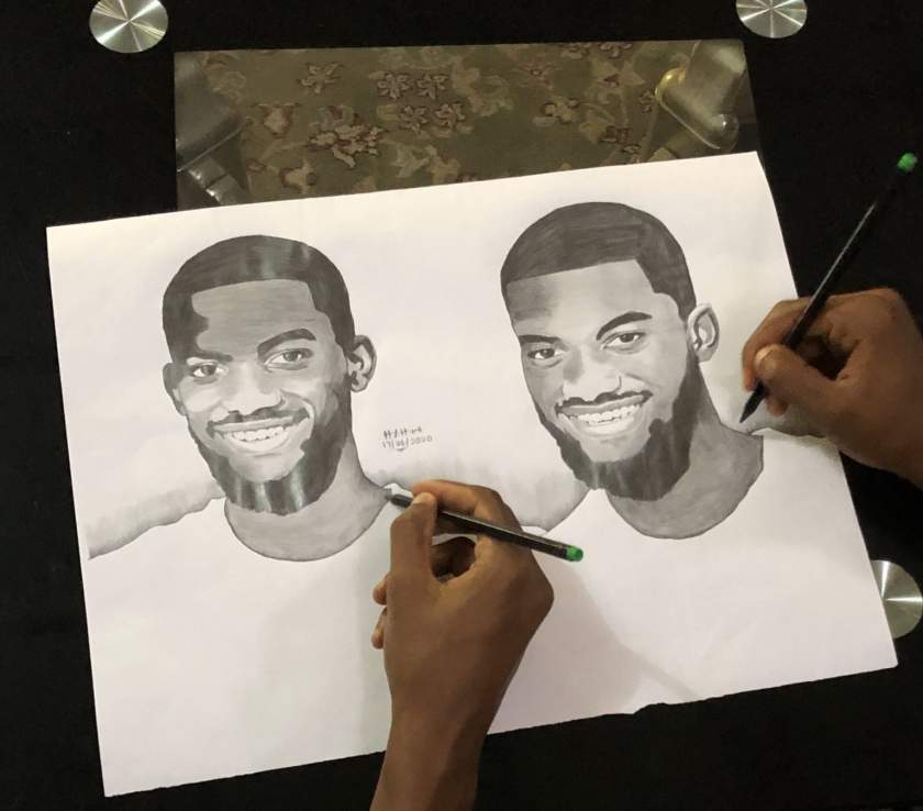 Talented twins draw themselves at the same time while looking at each other (Photos)