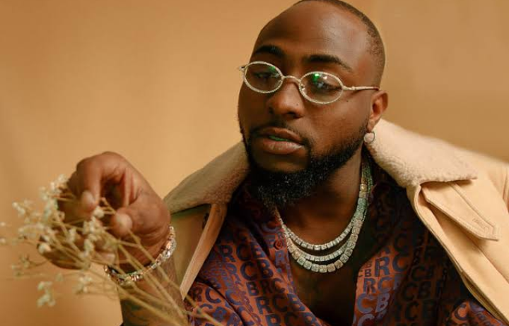 Davido signs May D into his record label, DMW (Photos)