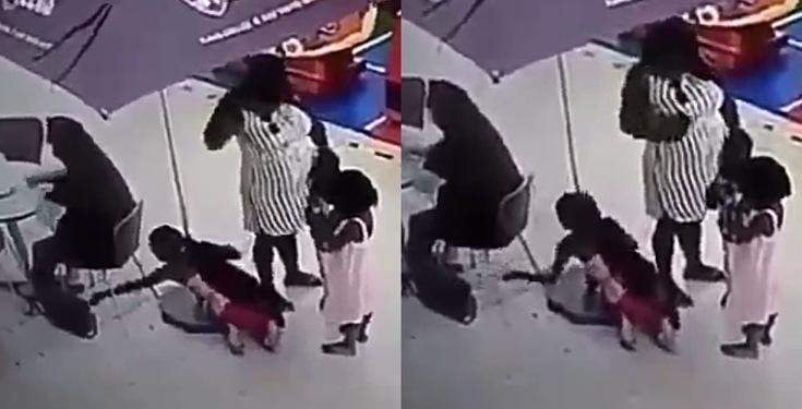 Little girl caught on camera stealing a lady's bag while her mother watched (Video)