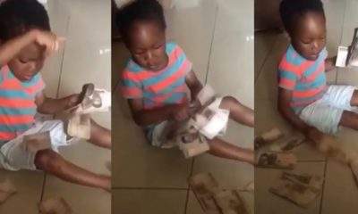"Opor is plenty, I will do Yahoo" - Little boy says as family members spray Naira notes on him (Video)