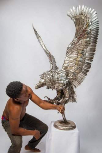 Meet Nigerian artist who makes amazing sculptures using spoons and forks (Photos)