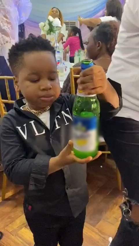 Outrage as little boy consumes full bottle of beer in the presence of adults at a party (Video)