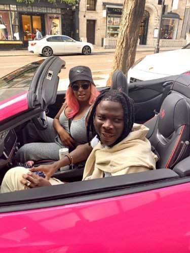 DJ Cuppy hits the streets of London riding with Stonebwoy, in her new Ferrari (Video)