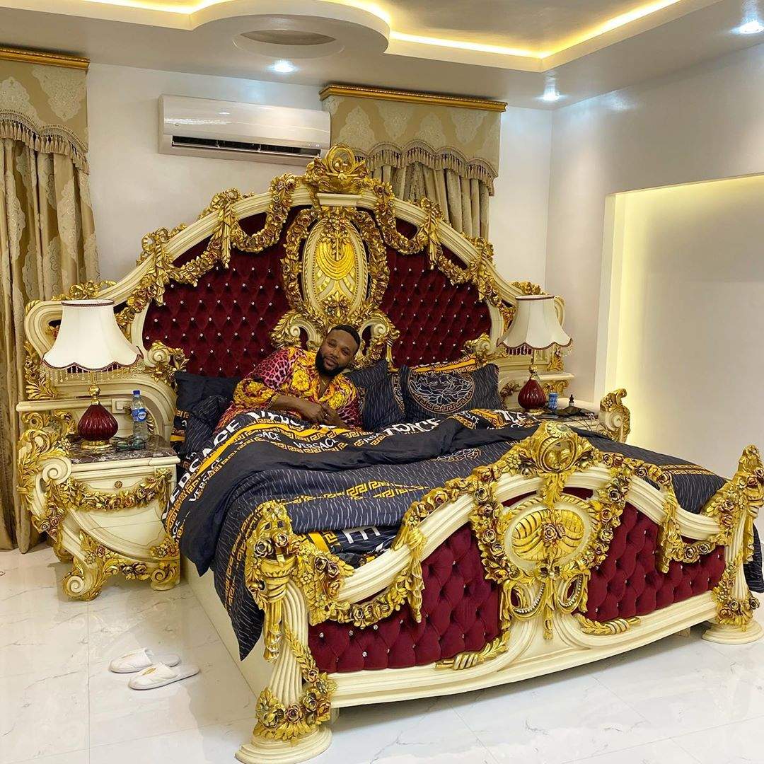 E-money shows off his golden bedroom in luxurious new home.
