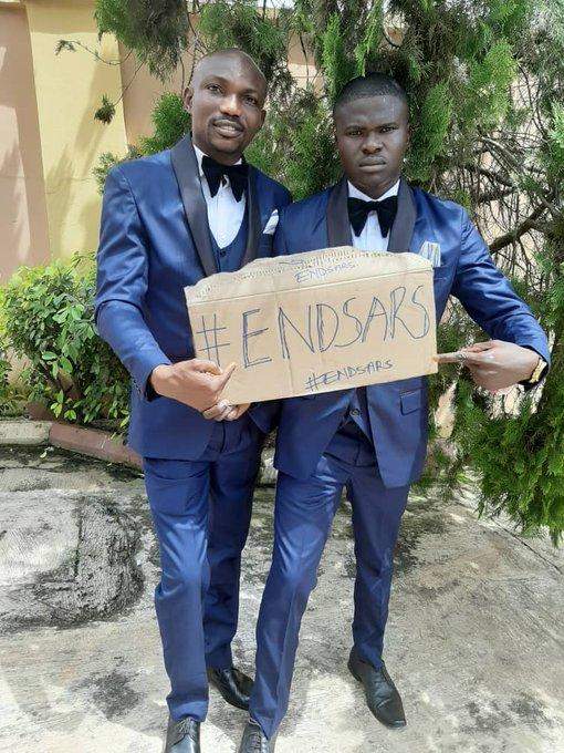 Newly wedded couple use #EndSARS placard in wedding photos