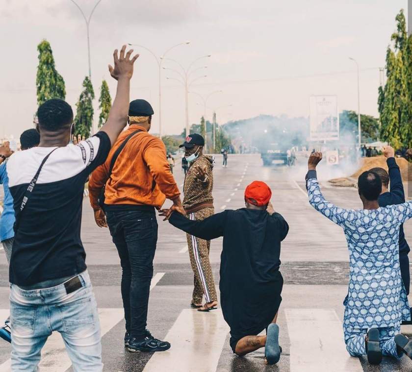 Davido goes down on his knees to beg for the release of 20 protesters