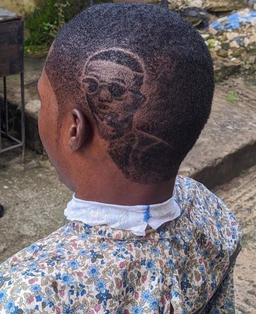 Nigerian Barber Goes Viral After Carving Wizkid's Face On Customer's Hair (Photos)