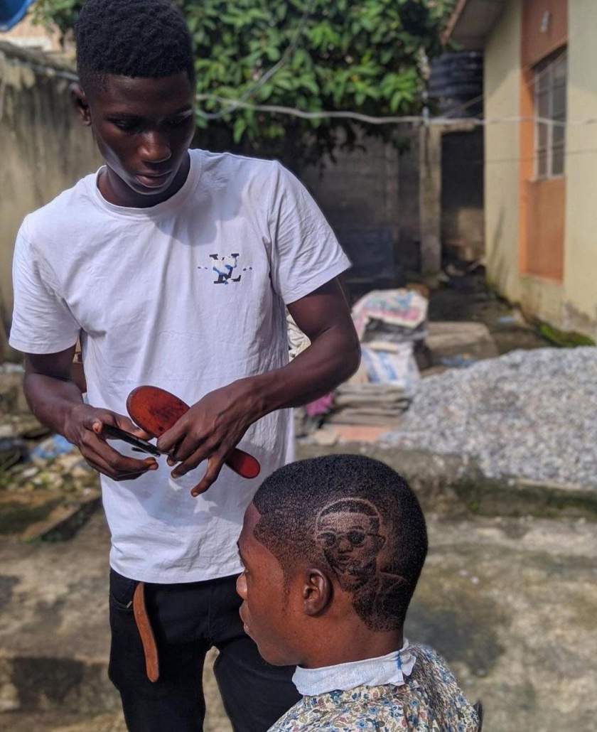 Nigerian Barber Goes Viral After Carving Wizkid's Face On Customer's Hair (Photos)