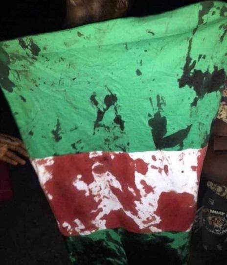 blood stained flag of Nigeria, #endsars protest, lekki massacre