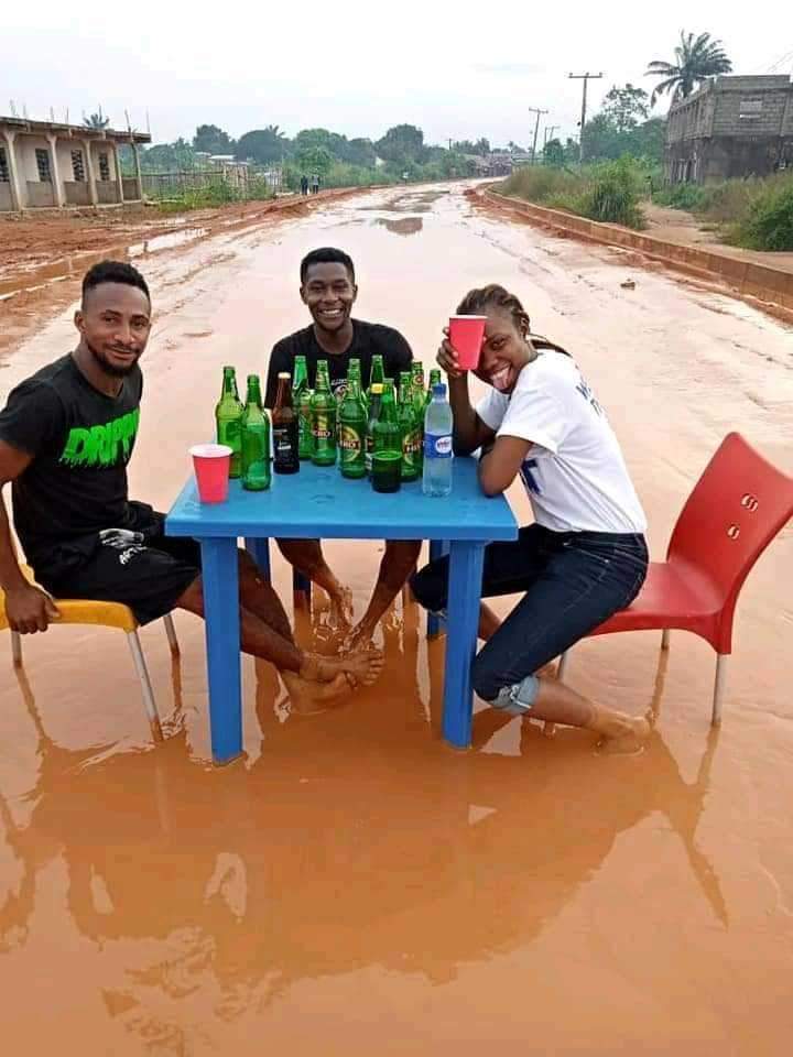 'In celebration of bad road' - Says residents of Imo state as they drink beer on muddy road