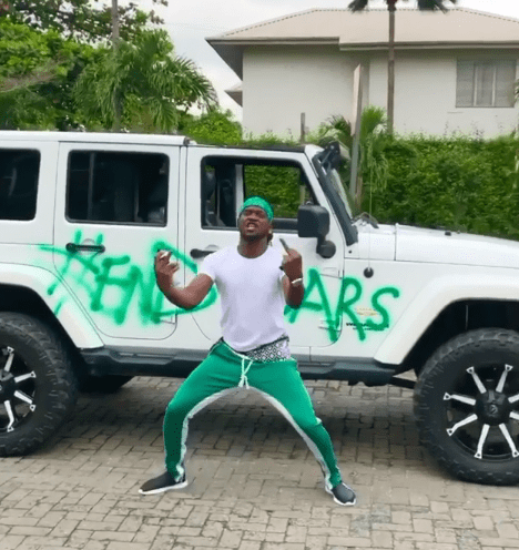 Paul Okoye Sprays His White Mercedes Jeep With #EndSars (Video)