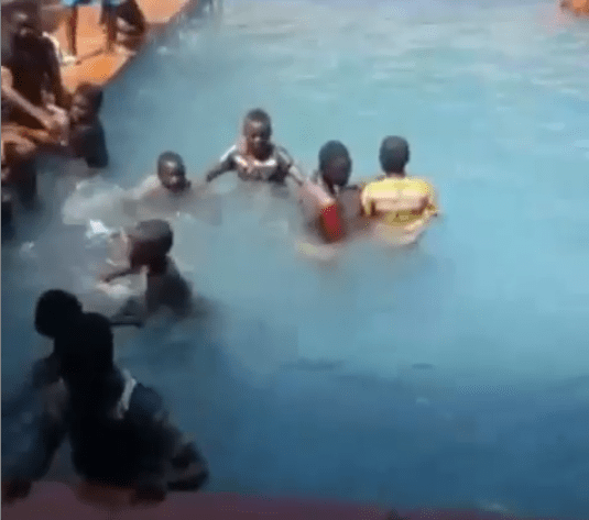 Children enjoying a swim in Oba of Lagos' pool after hoodlums vandalised the palace (Video)