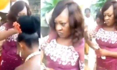 Nigerians react to video of woman frowning her face while spraying money on a bride during wedding