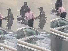 Police officers seen assaulting a man in broad daylight (Video)