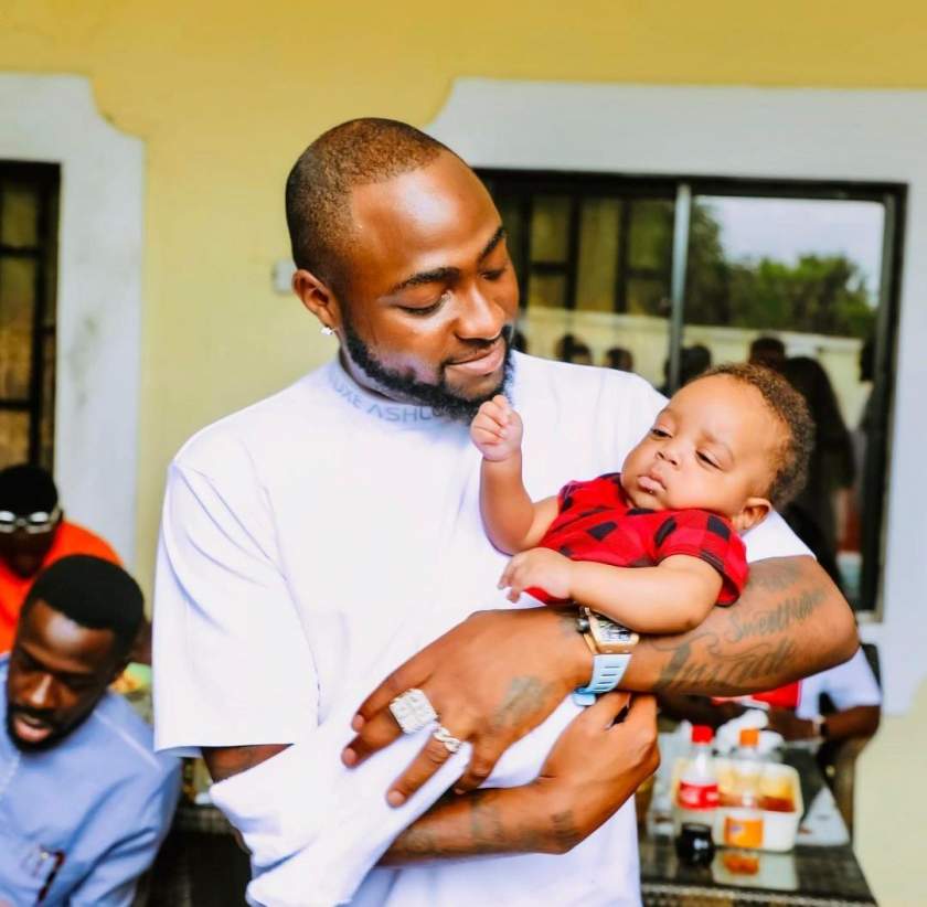 Checkout these adorable photos of Davido cuddling Regina Daniels' son, Munir