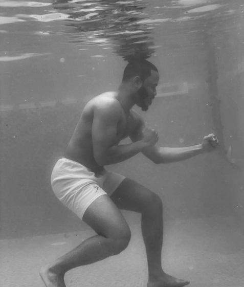 BBNaija star, Ozo Recreates 1961 Picture Of Legendary Boxer, Muhammad Ali Training In A Pool