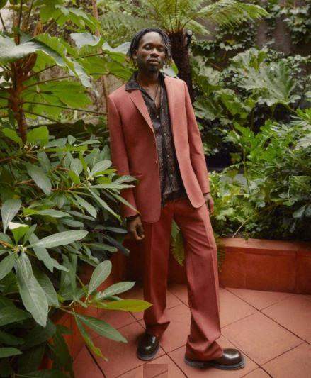 Mr. Eazi lambast follower that attacked his Paul Smith designer suit