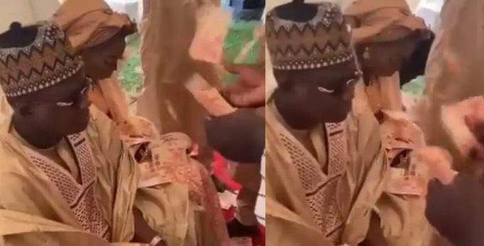 'The couple looked unhappy'- Nigerians react to viral video of couple being sprayed ₦10 notes by their friends at their wedding