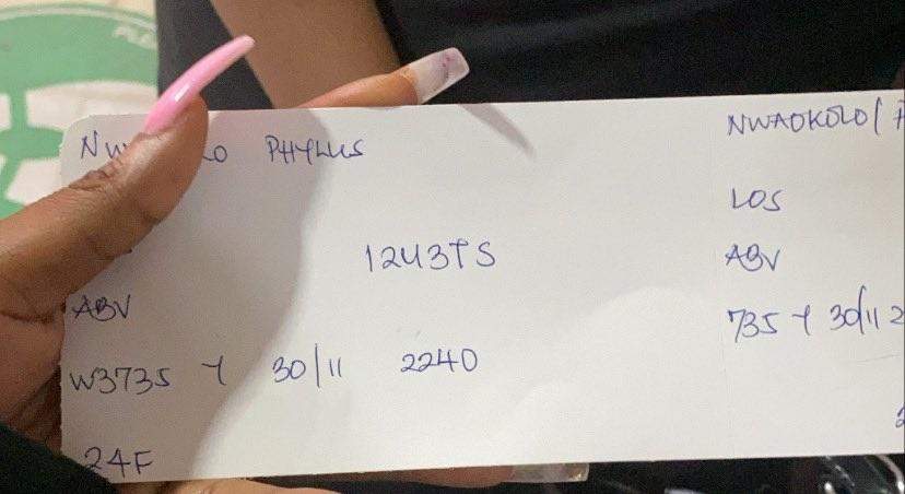 Lady laments over handwritten boarding pass she got from Nigerian airline