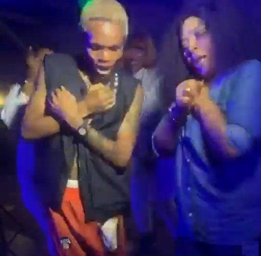 rita daniels and her son dancing in a club