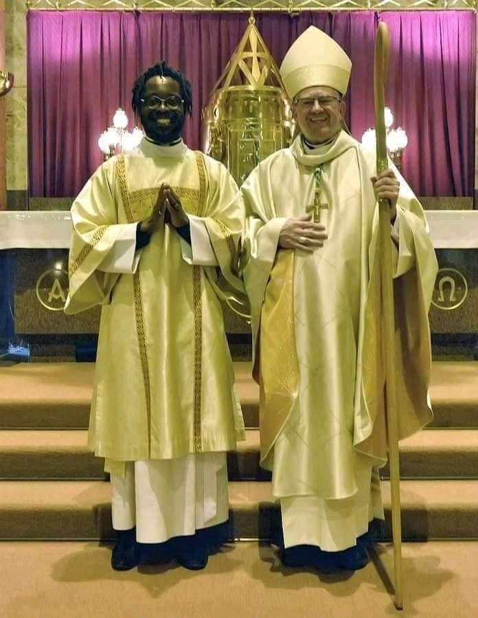 Man with dreadlocks as Catholic Priest Man with dreadlocks as Catholic Priest