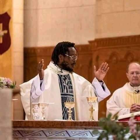 Man with dreadlocks as Catholic Priest Man with dreadlocks as Catholic Priest