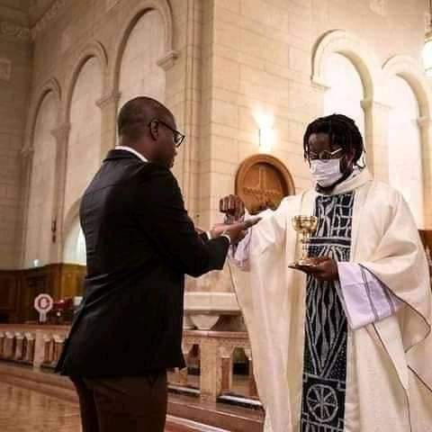 Man with dreadlocks as Catholic Priest Man with dreadlocks as Catholic Priest