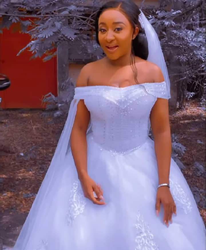 Actress, Ini Edo dazzles in wedding gown as she allegedly holds secret