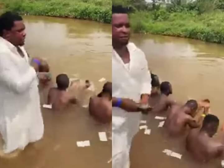 Alleged money ritual; Prophet seen spraying money on young men in a river (Video)