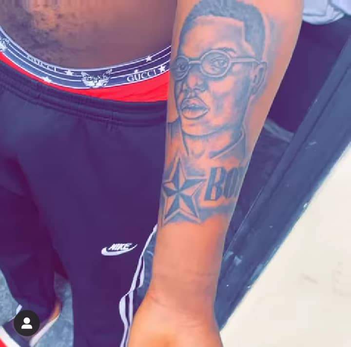 Wizkid reacts as die-hard fan tattoos his face on his arm (Video)