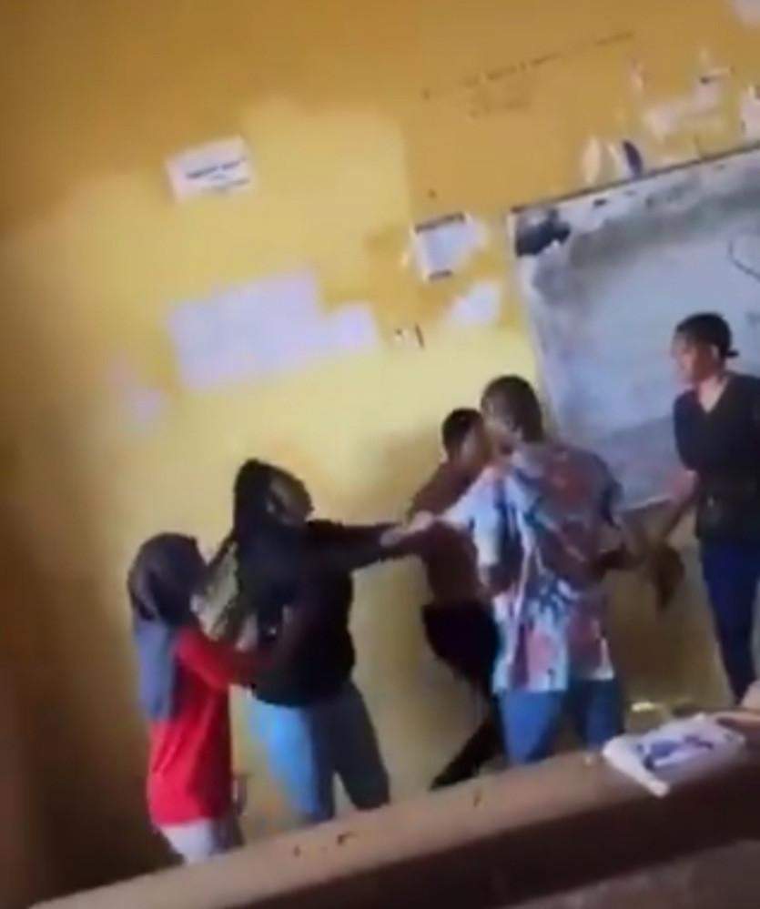 Student fights her lecturer and tears his shirt for not allowing her write an exam (Video)
