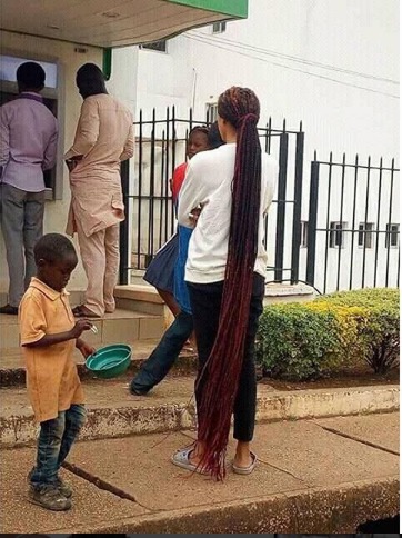 Wow!!! Lady with a floor length braid spotted earlier today at a bank in Jos