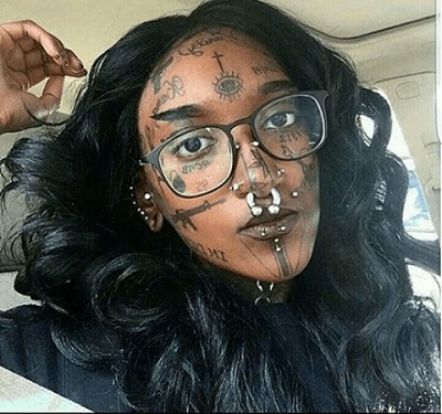 Trending Photo: Lady with tattoos all over her face