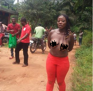 Nigerian Slay Queen Caught And Disgraced After She Jumped Into Someone's Fence To Steal Biscuit In Anambra (Photos)